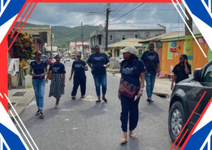 Universal Church members walking through the streets of Dennery, Saint Lucia, during community outreach