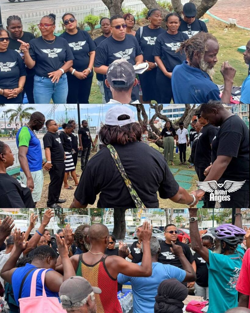 People raising their hands in prayer during the Night Angels outreach in Barbados
